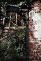 Carbonized door post in wall of abandoned building.