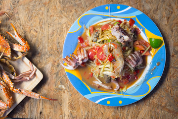 Close up of Thai papaya salad with seafood