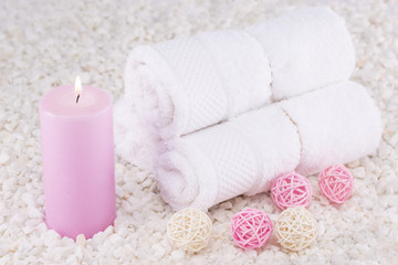 Fototapeta na wymiar Spa. Still life. Towels rolled up, a pink candle