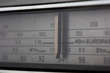 Vintage radio tuning dial, strong differential focus. Styled photo