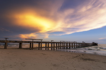 Fototapeta premium Seascape sunset with old Bridge at Ao Mae Ramphueng,Rayong Province,Thailand