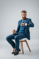 stylish man checking time on watch