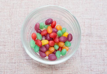 Colorful candies on a brown background
