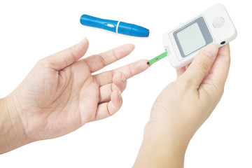 Woman is checking diabetes using blood checking kit isolated over white