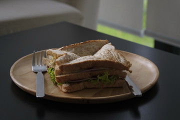 Sandwiches made from bread,ham,cheese,vegetables and nutritious foods for breakfast of the day.
