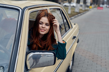 Fototapeta na wymiar Beautiful woman driving a car in the city