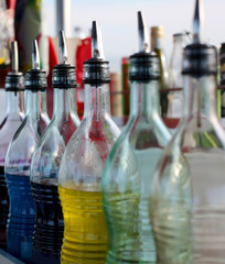 glass bottles with syrup to make Colorful summer slushies