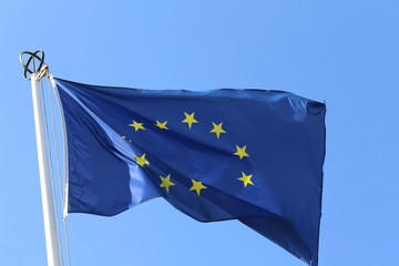 european flag with yellow stars and blue sky