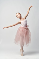 girl ballerina is dancing