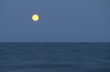 big full moon and the ocean