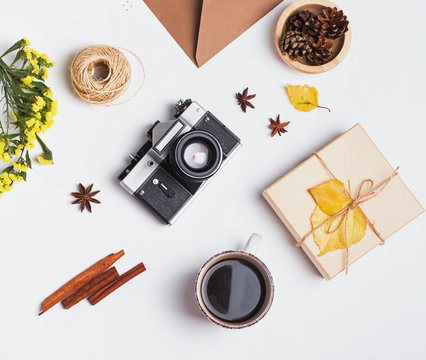 Coffee, vintage camera and small autumn related objects