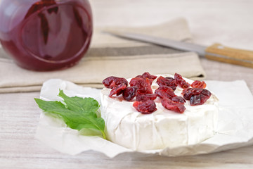 Dried cranberries on camembert cheese. 