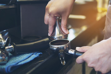 Vintage photo of barista is making coffee in coffee shop