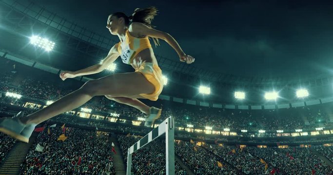 Track and field runner hurdles on sports arena