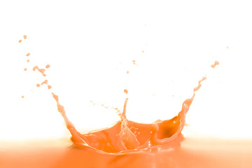 Naklejka na ściany i meble orange wine splash isolated on white