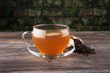 A glass cup of tea. Tea time