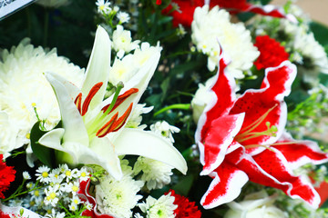 A coffin with a flower arrangement in a morgue