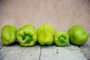 Ripe Yellow, Red and Green Peppers in Vegetables Market