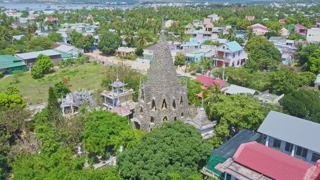 Upper Panorama Coral Buddhist Temple in City against Sea