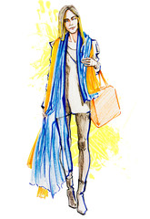 Beautiful woman with blue scarf and orange bag