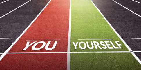 Race Against Yourself Concept with Powerful and Motivation, Present by Text lay on Running Track at Arena Stadium