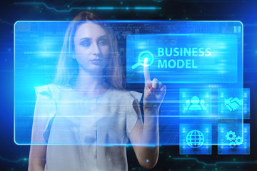 The concept of business, technology, the Internet and the network. A young entrepreneur working on a virtual screen of the future and sees the inscription: Business model