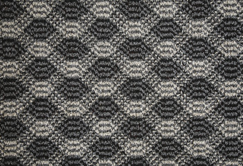 Texture of textile rug with pattern of white and gray colors
