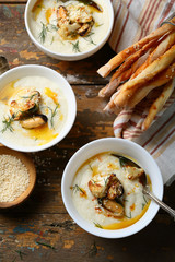 Cream soup with sea foods in bowls
