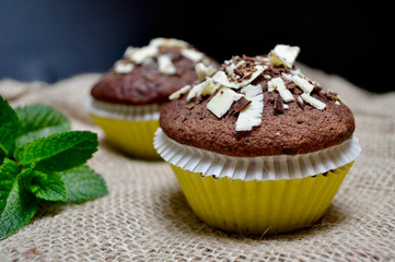 Closeup of Chocolate Muffins on a Rustic Burlap Sack.