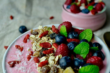 Healthy Smoothie Bowl with Raspberries, Blueberries, Goji Berries.