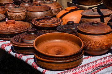 Different wooden pots for sale on a fair