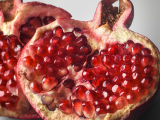 Selective focus close up of inside of pomegranate showing seeds