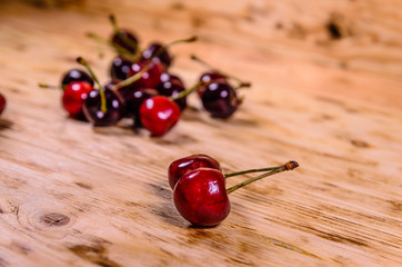 Fresh ripe cherries on wooden table