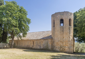 The ancient beautiful Pieve dei Santi Vito e Modesto di Corsignano church, in the countryside near Pienza, Siena, Italy, on a sunny summer day