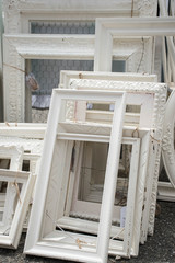 White empty vintage frames at a French street flea market in the city
