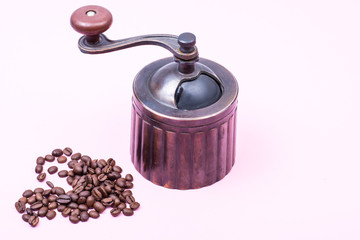 Black coffee beans on bright pastel background