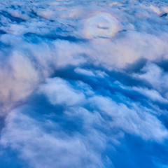 clouds and blue sky seen from airplane