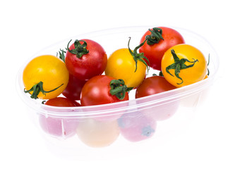 Small colored cherry tomatoes on white background