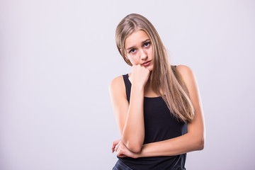 Woman bored, tired on a gray background.