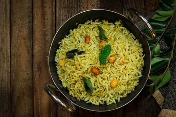 South Indian Curry leaves rice / Karuvepilai sadam served in a Kadai