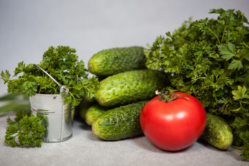 Healthy food concept, vegetables with little bucket on gray background