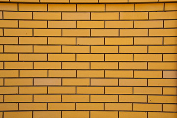 Obraz premium Yellow brick wall
