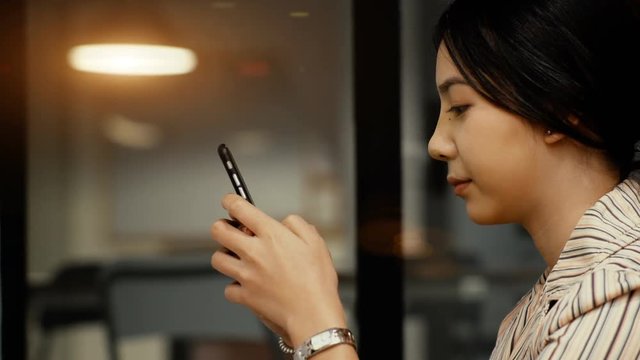 Asian young teenage cheerful when chatting with smartphone