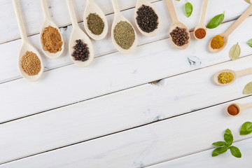 Spices on a white wooden table. 