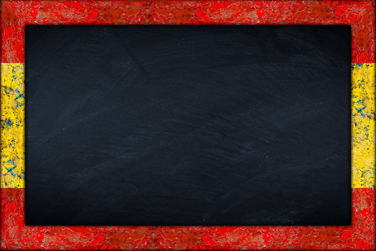 empty spain blackboard with wooden colorful frame isolated on white background / Spanien Tafel mit holzrahmen