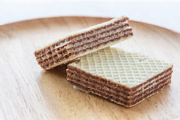 Closeup image, wafers on a wooden plate.