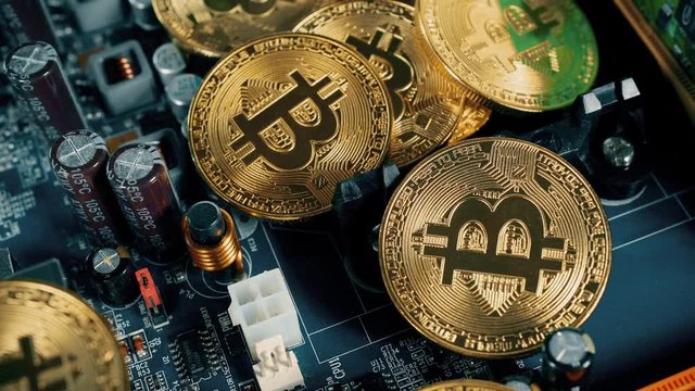 Crypto currency Gold Bitcoin - BTC - Bit Coin. Macro shots crypto currency Bitcoin coins rotating. Holomatrix style. Seamless looping.