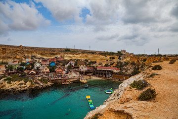 Fototapeta na wymiar Famous Popeye village in Malta. Azure bay in the rocks.