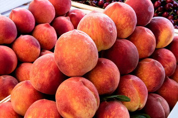 Wooden boxes with peaches at market.