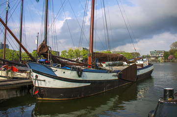 Old wooden boat at the Amsterdam harbour